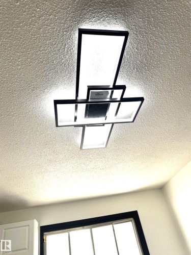 Modern geometric ceiling light fixture with integrated fan - 45 Lambert Crescent, St. Albert, AB 