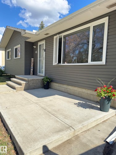 Contemporary gray siding exterior with white window trim - 45 Lambert Crescent, St. Albert, AB 