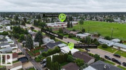 Aerial overview of the neighborhood, highlighting 130 Ave NW, the property at 7515 130 Ave NW, Edmonton, and Princeton School - 