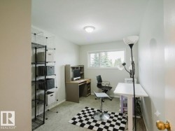 Bright room with light gray wall paint and gray carpeted flooring - 