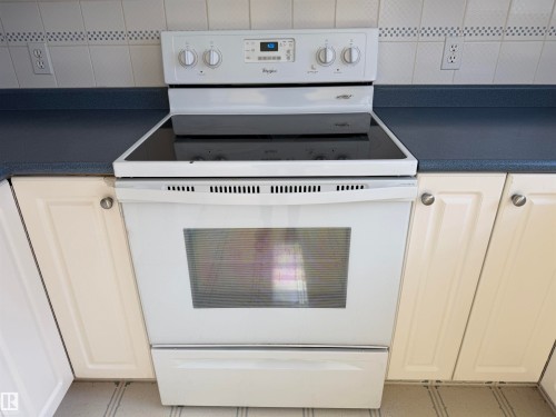 White electric range with a smooth cooktop and oven window - 7317 83 Avenue, Edmonton, AB 