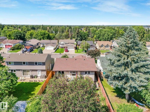 Aerial perspective highlighting a residential neighborhood with numerous homes featuring various architectural styles - 2035 49A Street, Edmonton, AB 