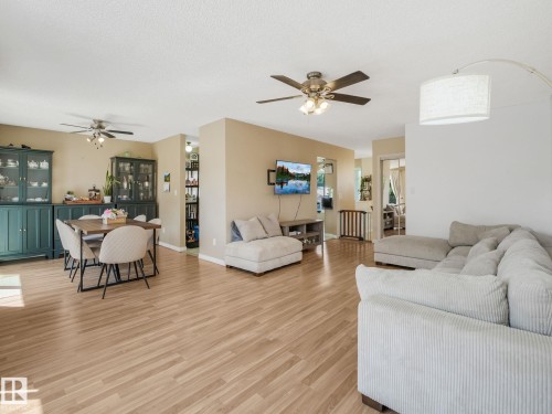 Open-concept living area featuring wood-finish flooring throughout - 2035 49A Street, Edmonton, AB 