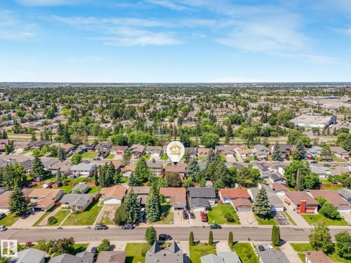 Residential neighborhood featuring a grid-pattern street layout, mature trees, and a mix of single-story and two-story homes - 2035 49A Street, Edmonton, AB 