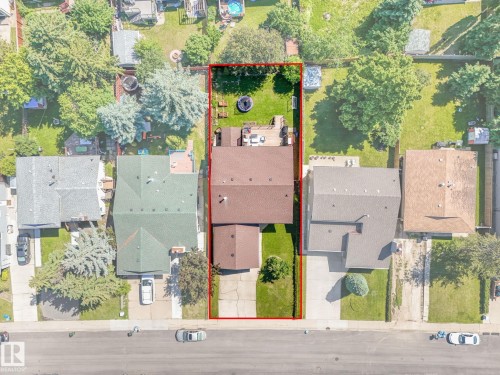 Residential property with a brown shingle roof and a concrete driveway - 2035 49A Street, Edmonton, AB 