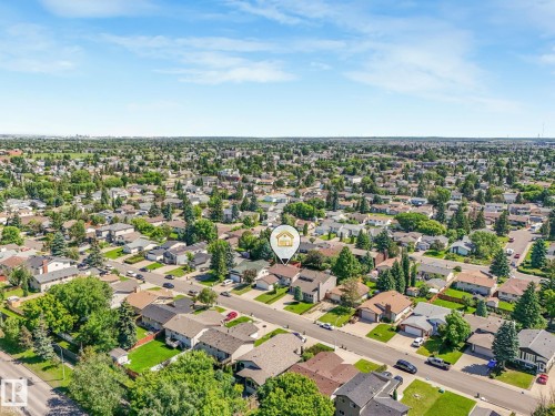 Expansive aerial view of a residential neighborhood with established homes and mature trees - 2035 49A Street, Edmonton, AB 