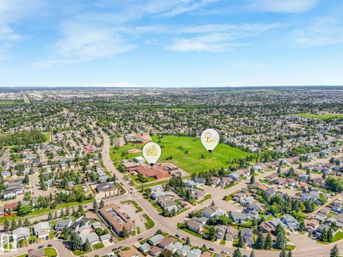 Aerial perspective showcasing a residential area with extensive green spaces and established tree coverage - 2035 49A Street, Edmonton, AB 