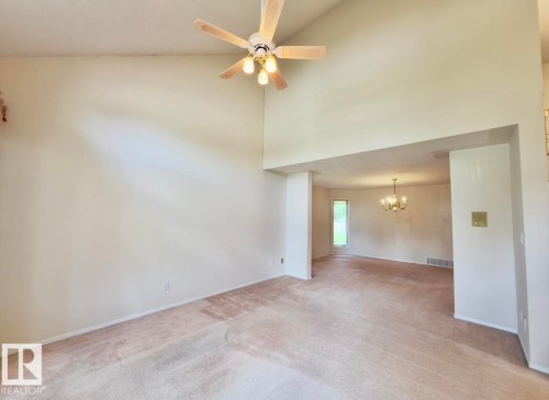 Vaulted ceiling featuring a ceiling fan with integrated lighting - 134 Wolf Ridge Place, Edmonton, AB 