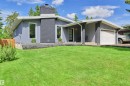 Contemporary architectural design featuring a prominent chimney, a single-car garage, and a covered entryway - 28 Goodridge Drive, St. Albert, AB 