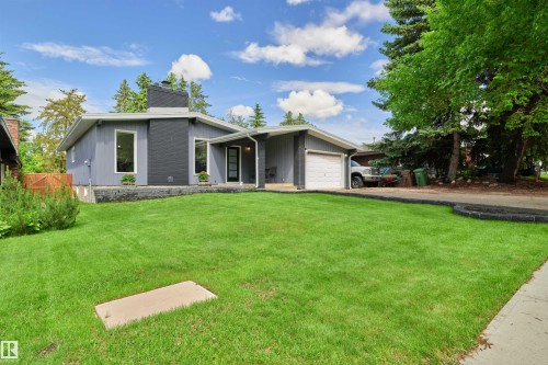Contemporary single-story residence featuring a striking dark gray facade and a light gray exterior - 28 Goodridge Drive, St. Albert, AB 