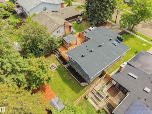 Overhead view of a property featuring a multi-level wood deck, a modern gazebo, and a fire pit area - 28 Goodridge Drive, St. Albert, AB 
