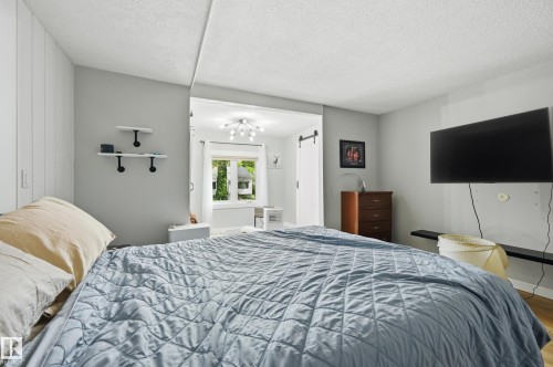 Bedroom with light gray walls and white trim - 12326 92 Street, Edmonton, AB - Indoor Photo Showing Bedroom
