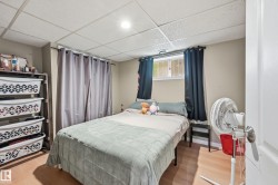 Light wood-finish flooring complements the neutral wall tones - 