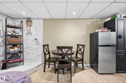 Recessed lighting illuminates a light wood-finish flooring - 
