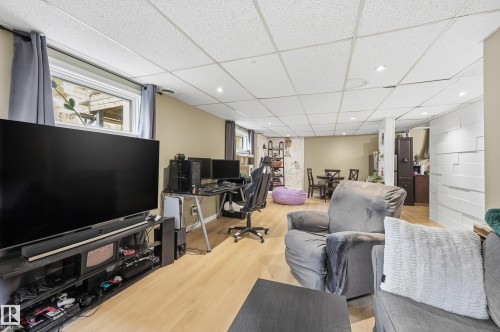 Open-concept space featuring light wood-finish flooring and recessed lighting - 12326 92 Street, Edmonton, AB - Indoor