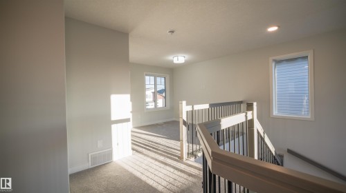 Upper landing featuring carpeted flooring and white walls - 44 Dalquist Bay, Leduc, AB 