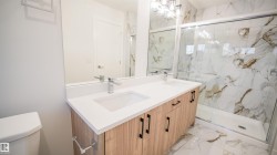 Double vanity with integrated sinks and white countertops - 