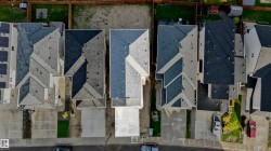 Aerial perspective showcasing multiple residential properties - 