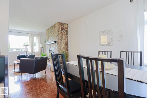 Dining area with dark wood-finish table and chairs - 2007 67 Street, Edmonton, AB 