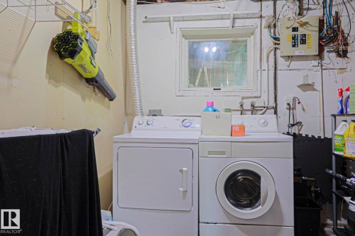 Laundry area featuring a window, washer, and dryer - 2007 67 Street, Edmonton, AB 