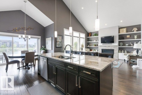 24 Elise Place, St. Albert, AB - Indoor Photo Showing Kitchen With Fireplace With Double Sink With Upgraded Kitchen
