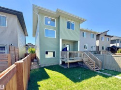 Modern two-story exterior with horizontal siding and a shed-style roofline - 