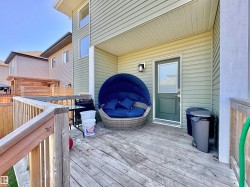 Expansive wood deck with a privacy fence - 