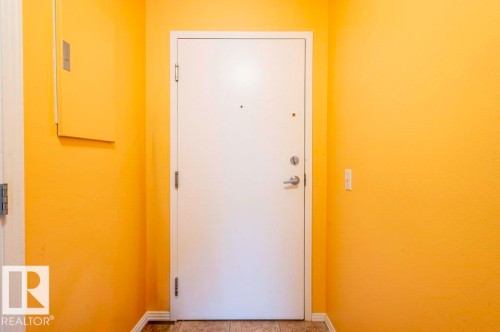Spacious unit foyer with room for a bench and shoes with a closet & laundry room. - 303 10528 77 Avenue, Edmonton, AB 