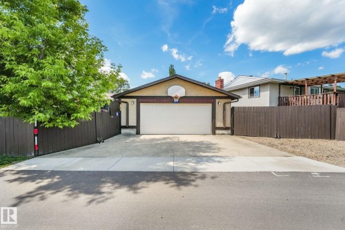 Attached garage with a white overhead door and basketball hoop - 17237 104 Street, Edmonton, AB 