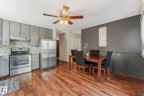 Combined kitchen and dining area featuring wood-finish flooring - 17237 104 Street, Edmonton, AB 