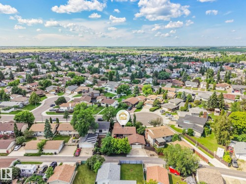 Neighborhood overview featuring a mix of residential rooflines, mature trees, and streetscapes with cul-de-sacs - 17237 104 Street, Edmonton, AB 