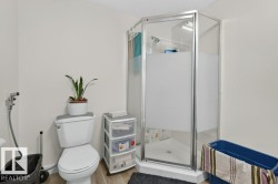 Shower enclosure featuring frosted glass panels and a chrome frame - 