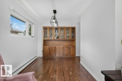 Built-in wood cabinetry with glass-front uppers and drawer storage - 