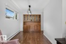 Built-in wood cabinetry with glass-front uppers and drawer storage - 6916 92A Avenue, Edmonton, AB 