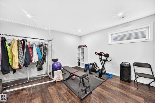 Versatile room featuring wood-finish flooring and recessed lighting - 12410 171A Avenue, Edmonton, AB 