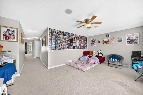 Carpeted room with a ceiling fan light fixture and a recessed ceiling speaker - 12410 171A Avenue, Edmonton, AB 