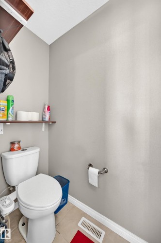 White ceramic toilet with a round bowl and tank - 12410 171A Avenue, Edmonton, AB 