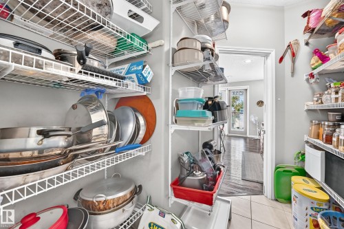 Walk-in pantry featuring extensive wire shelving for comprehensive storage - 12410 171A Avenue, Edmonton, AB 