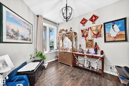 Hardwood-finish flooring complementing light grey walls - 12410 171A Avenue, Edmonton, AB 