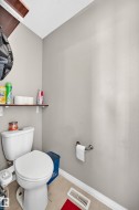 White ceramic toilet with a round bowl and tank - 
