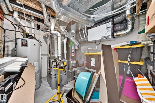 Utility area featuring a water heater, furnace system, extensive ductwork, and a Lifebreath air exchange unit - 12410 171A Avenue, Edmonton, AB 