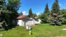 Detached garage with horizontal siding and a single overhead door - 5416 51 Avenue, Andrew, AB 