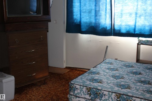 Image quality insufficient for description - 5416 51 Avenue, Andrew, AB - Indoor Photo Showing Bedroom