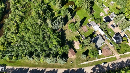 Expansive property featuring a blend of treed areas and developed residential plots - 5416 51 Avenue, Andrew, AB 