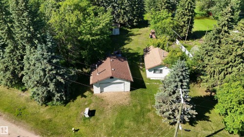 Two residential structures situated on a treed lot - 5416 51 Avenue, Andrew, AB 