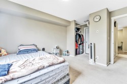 Neutral-toned walls complement the light-colored carpeting - 
