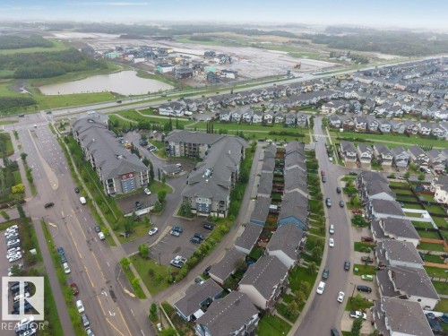Aerial perspective showcasing a residential community with varied housing styles - 225 111 Watt Common, Edmonton, AB 