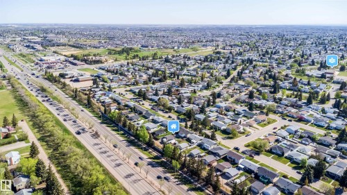 Aerial perspective showcasing a residential neighborhood with a prominent multi-lane thoroughfare - 14808 96 Street, Edmonton, AB 