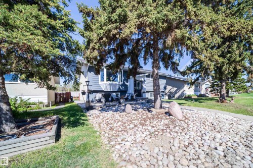 Split-level residence featuring blue siding and white trim - 14808 96 Street, Edmonton, AB 