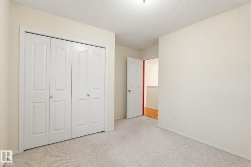 Recessed bi-fold closet doors provide storage - 1906 37B Av, Edmonton, AB 